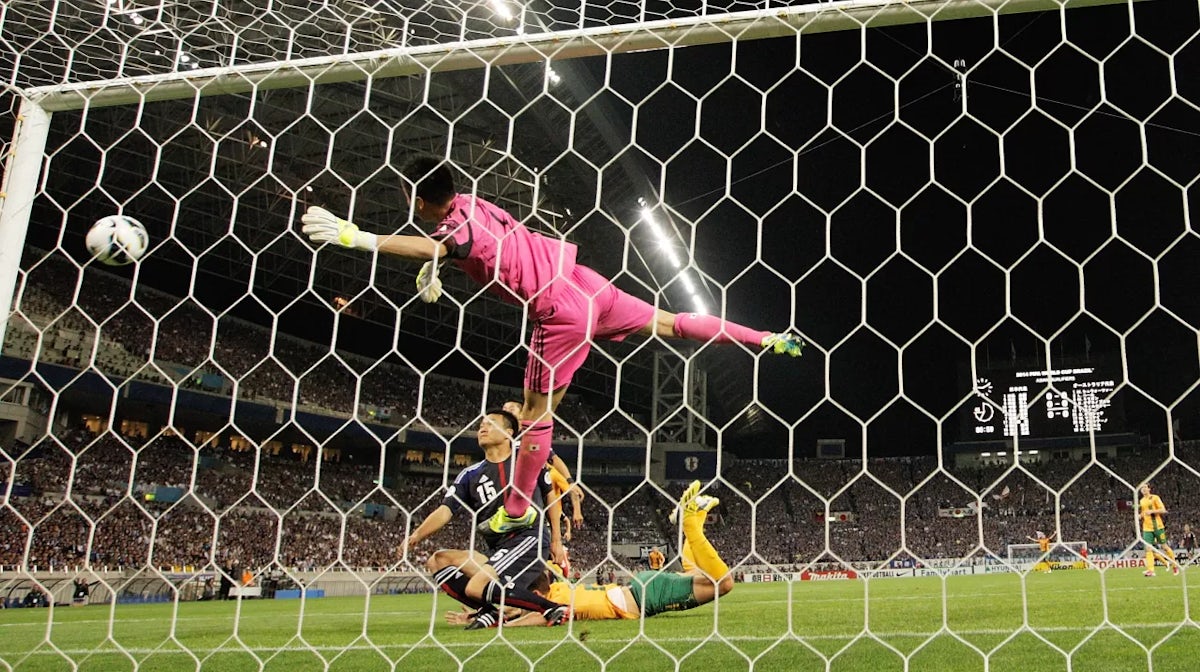 Late penalty denies Socceroos victory