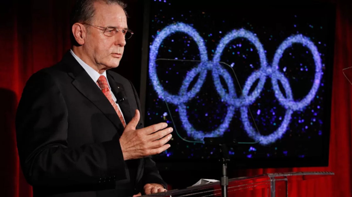 Rogge visits refugees and IOC mourns Sir Tay