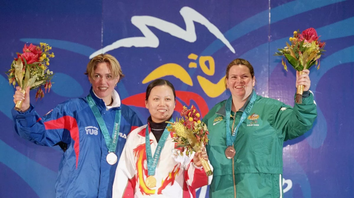  Silver Medallist Jasna Sekaric of Yugoslavia, Gold Medallist Luna Tao of China and Bronze Medallist Annemarie Forder of Australia on the podium after the Womens 10m Air Pistol Shooting event at the Sydney International Shooting Centre on Day Two of the S