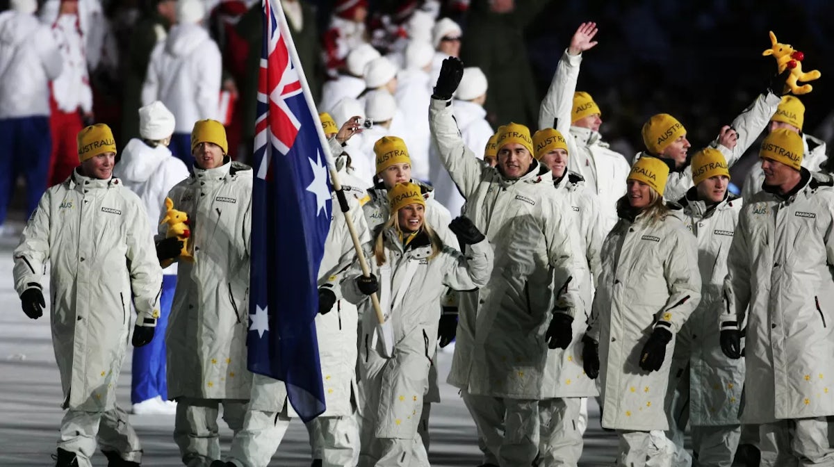 Australia's gold medal winning aerial skier, Alisa Camplin, carries the nation's flag in front of her teammates during the Opening Ceremony of the Turin 2006 Winter Olympic Games on February 10, 2006 at the Olympic Stadium in Turin, Italy. (Photo by Steph