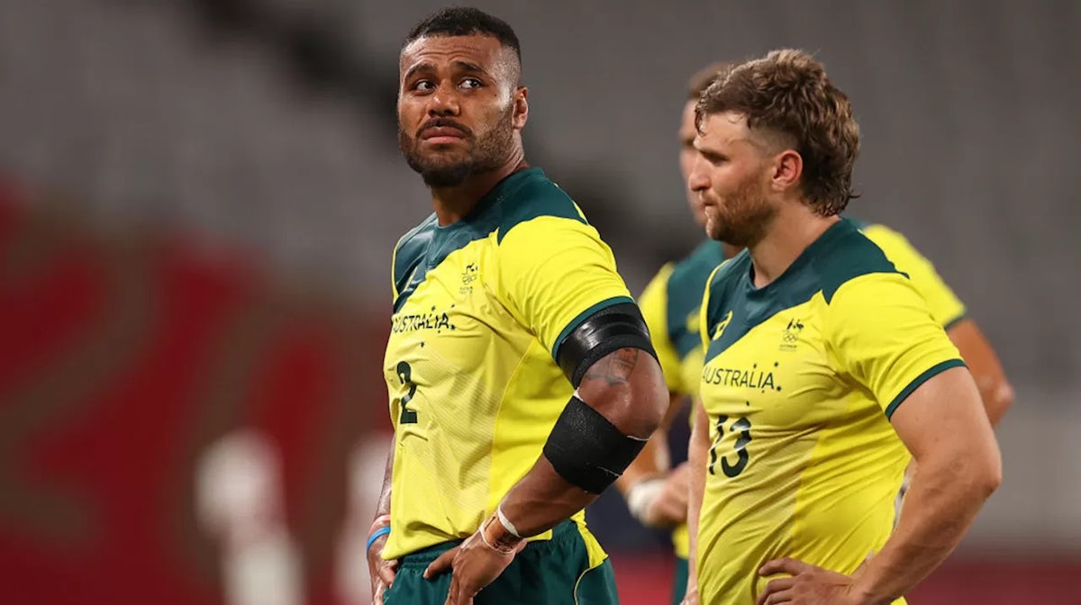 Samu Kerevi and Lewis Holland of Team Australia look dejected after their defeat during the Rugby Sevens Men's Quarter-final match between Australia and Fiji on day four of the Tokyo 2020 Olympic Games at Tokyo Stadium
