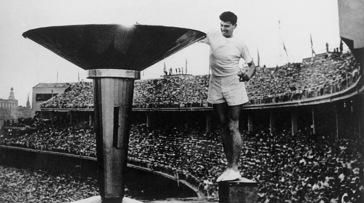 Ron Clarke lighting the the flame at the Melbourne 1956 Olympic Games