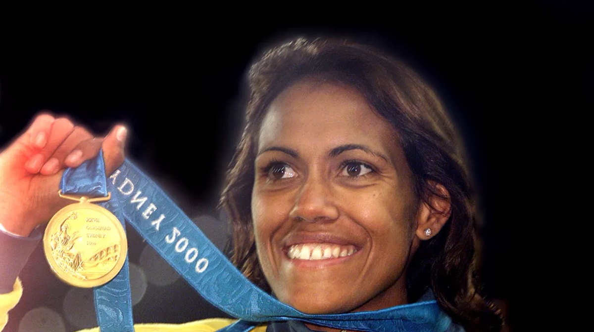 SYDNEY, AUSTRALIA - SEPTEMBER 25: (FILE PHOTO) Cathy Freeman of Australia celebrates with her Gold medal after winning the Women's 400m final at the Sydney 2000 Olympic Games, Sydney Australia (Getty Images)