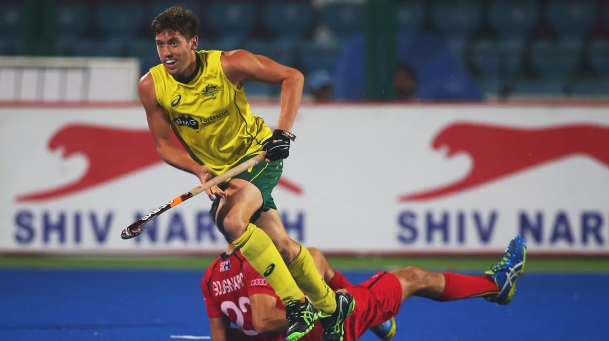 Eddie Ockenden of Australia vies with Simon Gougnard of Belgium during the final match between Australia and Belgium on day ten of The Hero Hockey League World Final at the Sardar Vallabh Bhai Patel International Hockey Stadium on December 06, 2015 in Rai