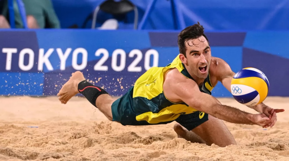 Damien Schumann dives for the ball in their men's preliminary beach volleyball pool A match between Norway and Australia during the Tokyo 2020 Olympic Games at Shiokaze Park in Tokyo on July 24, 2021